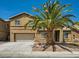 Two-story home featuring a front yard with desert landscaping and a large palm tree at 3516 Bryan Keith Ave, North Las Vegas, NV 89031