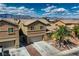 Aerial view of a home showcasing its desert landscaping and multi-car garage at 3516 Bryan Keith Ave, North Las Vegas, NV 89031