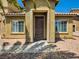 Front entrance featuring a covered porch with decorative stone and desert landscaping at 3516 Bryan Keith Ave, North Las Vegas, NV 89031