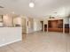 Spacious living room featuring built-in shelving, an open floor plan, and tile flooring at 3516 Bryan Keith Ave, North Las Vegas, NV 89031