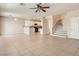 Open-concept living room featuring tile floors, an open floor plan, and stairs to the second floor at 3516 Bryan Keith Ave, North Las Vegas, NV 89031