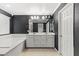 Modern bathroom featuring a double vanity, soaking tub, contemporary fixtures, and ample lighting at 356 Free Fall Ave, North Las Vegas, NV 89084