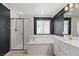 Stylish bathroom featuring a glass-enclosed shower, large tub, and modern fixtures at 356 Free Fall Ave, North Las Vegas, NV 89084