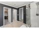 Bathroom featuring a glass shower enclosure and entryways to closets and other rooms at 356 Free Fall Ave, North Las Vegas, NV 89084