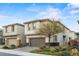 Charming two-story home with neutral stucco, stone accents, well-maintained landscaping, and a two-car garage at 356 Free Fall Ave, North Las Vegas, NV 89084