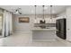 Modern kitchen featuring an island with a sink, pendant lighting, stainless steel appliances, and ample counter space at 356 Free Fall Ave, North Las Vegas, NV 89084