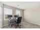 Bright, carpeted office space featuring a window, modern desk setup, and comfortable chair at 356 Free Fall Ave, North Las Vegas, NV 89084