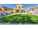 Grassy backyard featuring seating area, landscaping and lots of room to entertain at 3645 Bella Legato Ave, North Las Vegas, NV 89081