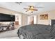 Cozy bedroom featuring plush carpet and a ceiling fan providing a relaxing ambiance at 3645 Bella Legato Ave, North Las Vegas, NV 89081