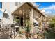 Inviting backyard patio featuring a grill, comfortable seating, and lush plants for outdoor enjoyment at 3681 Via Sonja Ave, Las Vegas, NV 89115