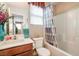 Cozy bathroom featuring a tub-shower combo, patterned shower curtain, and a single sink vanity at 3681 Via Sonja Ave, Las Vegas, NV 89115