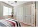 Bedroom featuring large window, closet, and neutral decor at 3681 Via Sonja Ave, Las Vegas, NV 89115