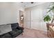 Bedroom featuring a small couch, large windows, and neutral decor at 3681 Via Sonja Ave, Las Vegas, NV 89115