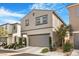 Charming two-story home featuring a well-manicured front yard and a two-car garage at 3681 Via Sonja Ave, Las Vegas, NV 89115