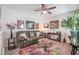 Inviting living room with a comfortable sofa, accent rug, and decorative artwork creating a cozy atmosphere at 3681 Via Sonja Ave, Las Vegas, NV 89115