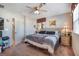 Carpeted main bedroom with ceiling fan and natural light at 3681 Via Sonja Ave, Las Vegas, NV 89115