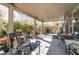 Inviting covered patio featuring outdoor seating, a barbecue grill, and lush greenery for relaxed outdoor living at 3681 Via Sonja Ave, Las Vegas, NV 89115