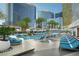 Resort-style pool area with lounge chairs, palm trees, and views of surrounding skyscrapers at 3750 Las Vegas Blvd # 2408, Las Vegas, NV 89158