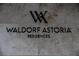 Close-up of 'Waldorf Astoria Residences' signage with minimalist design on a stone wall at 3750 Las Vegas Blvd # 2408, Las Vegas, NV 89158