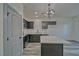 Modern kitchen featuring sleek gray cabinetry, stainless steel appliances, and a kitchen island at 382 E Erin St # 2, Pahrump, NV 89048