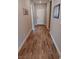 Hallway featuring wood-look flooring, leading to a bright and welcoming entryway at 3862 E Summit Ave, Pahrump, NV 89061