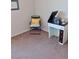 Neutral room with a sewing machine, 'happy place' pillow and carpeting at 3862 E Summit Ave, Pahrump, NV 89061