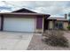 Single-story home with a two-car garage and low-maintenance landscaping at 4012 Mira Ln, Las Vegas, NV 89108