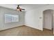Bright bedroom with window and ceiling fan at 4020 Smokey Fog Ave # 201, North Las Vegas, NV 89081