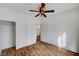 Bedroom featuring hardwood floors, ceiling fan, and closet at 4020 Smokey Fog Ave # 201, North Las Vegas, NV 89081