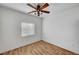 Bedroom featuring hardwood floors, ceiling fan and window, and neutral wall colors at 4020 Smokey Fog Ave # 201, North Las Vegas, NV 89081