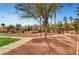 Beautiful community park featuring a playground, picnic tables, and lush landscaping at 4020 Smokey Fog Ave # 201, North Las Vegas, NV 89081