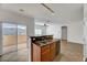 Open kitchen featuring double stainless sink, granite countertop, sliding glass door to balcony at 4020 Smokey Fog Ave # 201, North Las Vegas, NV 89081