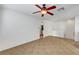 Spacious living room with tile flooring, ceiling fan, and neutral-toned walls at 4020 Smokey Fog Ave # 201, North Las Vegas, NV 89081