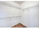 Spacious walk-in closet featuring ample shelving for optimal storage solutions at 4020 Smokey Fog Ave # 201, North Las Vegas, NV 89081