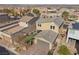 Rear aerial view of home with well-maintained backyard and attached garage at 408 Gracious Way, Henderson, NV 89011