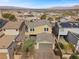 Rear aerial view of home with well-maintained backyard and attached garage at 408 Gracious Way, Henderson, NV 89011