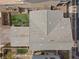 Aerial view of the property showcasing the roof, backyard with play area, and landscaping at 408 Gracious Way, Henderson, NV 89011