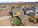 Rear aerial view of home with well-maintained backyard and attached garage at 408 Gracious Way, Henderson, NV 89011