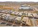 This aerial view showcases the residential homes alongside ongoing commercial development, promoting community growth and convenience at 408 Gracious Way, Henderson, NV 89011