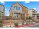 Lovely two-story home featuring manicured landscaping and a welcoming facade at 408 Gracious Way, Henderson, NV 89011