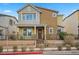 Charming two-story home featuring a well-maintained front yard and inviting entryway at 408 Gracious Way, Henderson, NV 89011