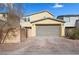 Attached two-car garage and paved driveway, offering ample parking at 408 Gracious Way, Henderson, NV 89011