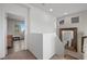 Upstairs hallway featuring neutral walls, carpeted floors, and view to a bedroom at 408 Gracious Way, Henderson, NV 89011