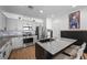 Modern kitchen featuring stainless steel appliances, gray cabinetry, and granite countertops at 408 Gracious Way, Henderson, NV 89011