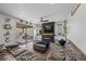 Comfortable living room with fireplace, a ceiling fan, and sliding doors to patio at 408 Gracious Way, Henderson, NV 89011