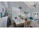 Cozy dining area with a modern chandelier, comfortable seating, and plenty of light at 4446 Scarlet Sea Ave, North Las Vegas, NV 89031