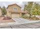 Inviting home with a well-manicured lawn, desert landscaping and a two-car garage at 4446 Scarlet Sea Ave, North Las Vegas, NV 89031