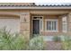 Charming front porch with manicured landscaping and a view of the front door and garage at 4446 Scarlet Sea Ave, North Las Vegas, NV 89031