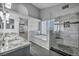 Luxurious bathroom features dual vanities, a soaking tub, and tiled shower at 4516 Whelk Pl, North Las Vegas, NV 89031