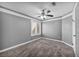 Neutral bedroom features a ceiling fan and a window with plantation shutters at 4516 Whelk Pl, North Las Vegas, NV 89031